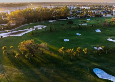 Aerial photo of the Royal Palm Yacht and Country Club golf course and driving range at sunset in Boca Raton Florida